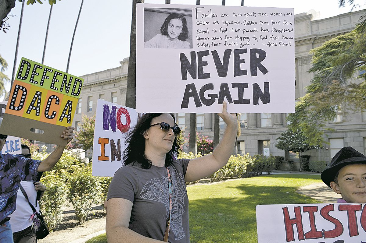 Protesting proposed migrant shelter